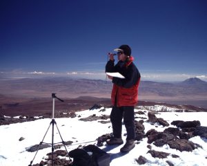 Ceruti reading compass on summit- credit to ceruti