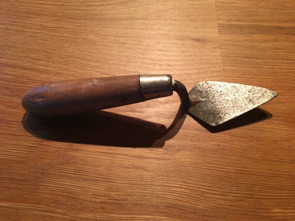 Every trowel tells a story. This is Glenys Lloyd Morgan's trowel. See how worn it is, testament to every dig that Gelnys ever worked in. Note the polish on the handle, where Glenys held it tight as she uncovered the past. Ceridwen Lloyd Morgan has entrusted her sister's trowel to us at TrowelBlazers, and we will endeavour to protect Glenys' legacy.