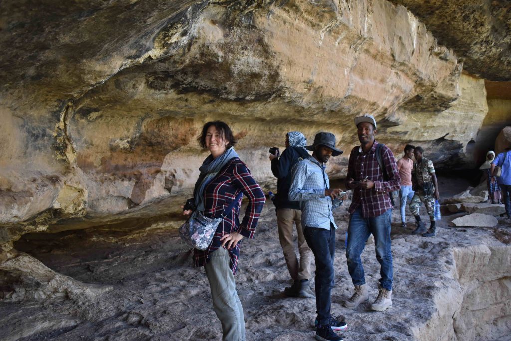 From left: Rachel MacLean at Laga Oda, a rock shelter in Ethiopia in 2020, with Endris Hussien Siraj, an MA Archaeology student at Addis Ababu University (AAU), and Temesgen Leta, Antiquity Officer at the ARCCH and MA Archaeology student at AAU.